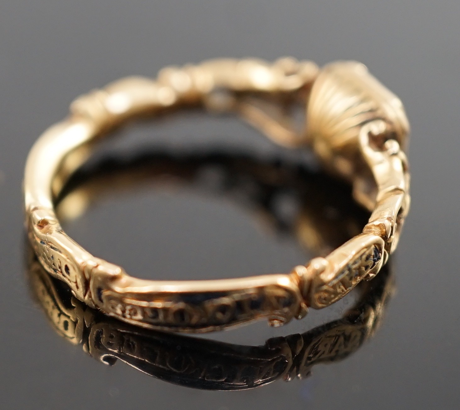 A George II gold, black enamel and rock crystal set mourning ring